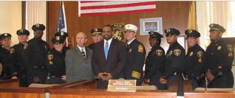 Mayor Eldridge Hawkins Jr. with Orange Township police and fire uniformed personnel